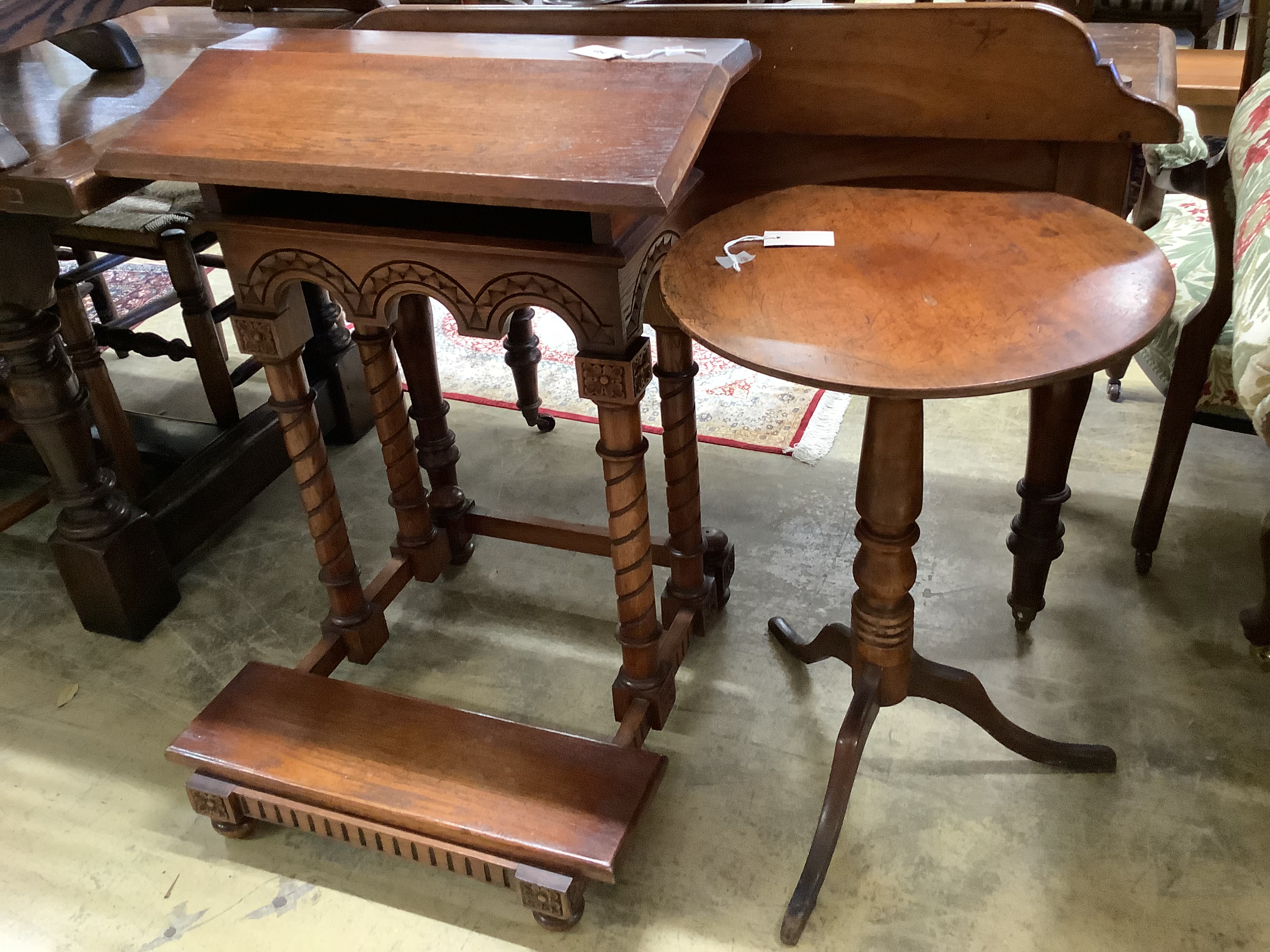 A Gothic style carved oak prie-dieu, width 64cm, height 82cm together with a 19th century circular mahogany tripod table, diameter 47cm